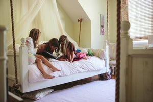 Sisters on Interior Bed Swing by Elizabeth Ervin